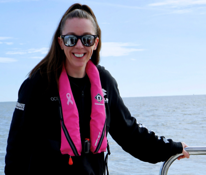 Survitec Crewsaver pink lifejacket on water.png